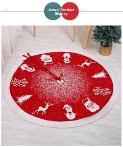 Detailed knit Christmas tree skirt featuring white festive patterns on red fabric background