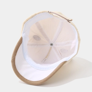 Detailed interior of corduroy baseball cap showing sweatband and adjustable buckle