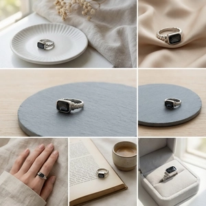 Macro shot of silver twisted ring featuring a black rectangular stone on elegant silk fabric