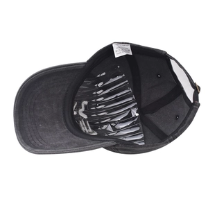 Detailed interior of a grey washed cotton baseball cap with labels and adjustable buckle