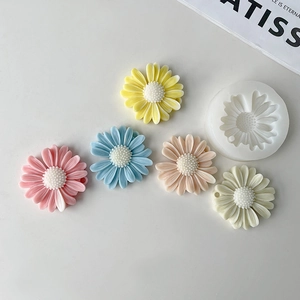 Daisy flower silicone mold with colorful resin sunflower pendants on white background