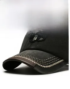 Detail der grauen Baseballkappe mit Leder-Krempeneinfassung und verstärkten Nähten