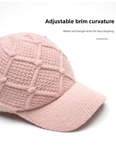 Detailed side view of pink knit baseball cap featuring flexible foldable brim and diamond pattern