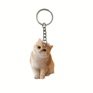 Acrylic tuxedo cat keychain with double-sided printing and a metal ring for backpacks
