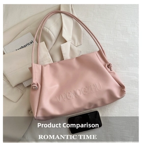 Close-up of embossed VVGNOGZHU lettering on a premium large pale pink tote bag