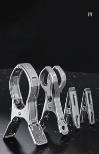 Close-up of waterproof stainless steel laundry clips with raindrops for windproof hanging