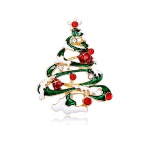 Detail view of a Christmas tree brooch with green enamel and sparkling red rhinestones