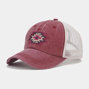 Detail of burgundy baseball cap featuring ethnic geometric embroidery and white mesh back