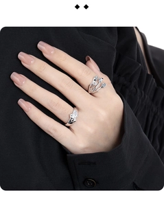 Close-up of S925 sterling silver heart ring and branch design with clear gemstones