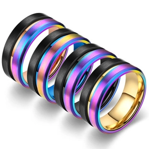 Detailed stack of black matte rings with rainbow plating and gold polished interior