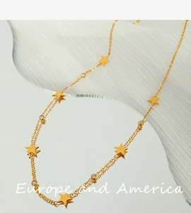 Detailed view of gold double-layered star necklace with sparkling cubic zirconia accents