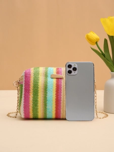 Rainbow straw camera bag detail with gold chain strap and smartphone size comparison