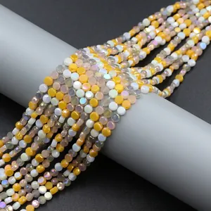 Detailed view of 4mm gradient crystal glass beads for DIY jewelry making on a grey stand