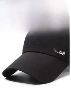 Close-up of a black baseball cap featuring detailed NALAS embroidery and structured brim