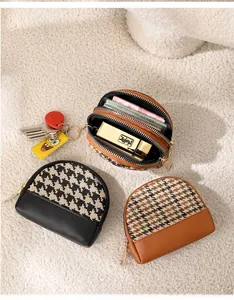Internal view of a multi-layer canvas coin purse showing organized storage for cards and lipstick