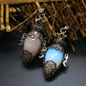 Detail of vintage copper pendants with hollow star patterns and inset crystals