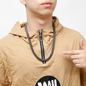 Close-up of a masculine dark grey stainless steel snake bone chain worn by a model