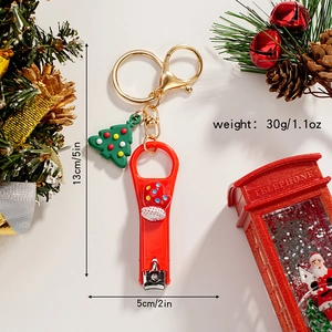 Detailed size and weight view of a Christmas stocking nail clipper keychain with a 3D tree
