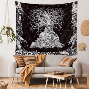 Gothic Tree of Life tapestry with skulls above a bohemian sofa in a modern living room