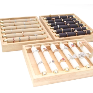 Three-piece wooden ring display trays with white, beige, and dark grey velvet inserts