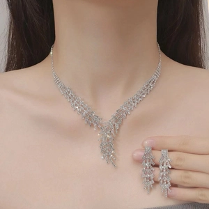 Elegant silver rhinestone necklace and earring set with tassels for formal evening wear