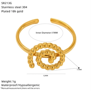 Macro detail of 18K gold plated bow ring with size measurements and 17mm inner diameter