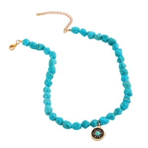 Bohemian turquoise beaded necklace featuring a golden sunburst pendant and lobster clasp