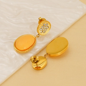 Detailed front and back view of 18K gold plated oval drop earrings with small diamonds