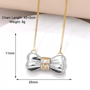 Detailed view of silver bow necklace with gold accents and cubic zirconia inlay dimensions