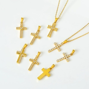 Polished gold cross pendants with cubic zirconia inlay and thin link chain necklaces