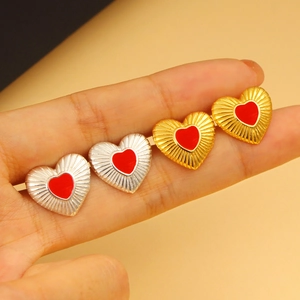 925 silver vintage heart stud earrings with red glaze and radial pattern on fingers