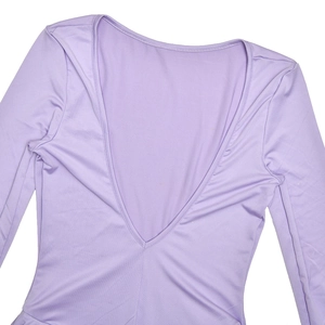 Detail of the plunging V-neck and soft knitted texture on the light purple dress