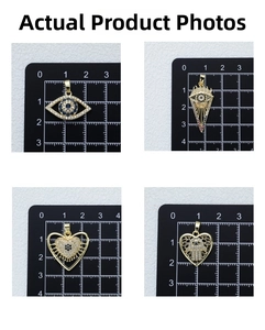 Detailed view of four gold-plated evil eye charms with cubic zirconia on measurement grid