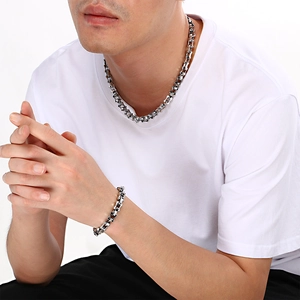 Close-up of 10mm stainless steel bamboo link necklace and bracelet set for men
