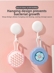 Detail showing flower-shaped silicone scalp brushes with massage bristles and hanging ropes