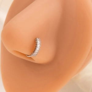 Detailed view of silver leaf nose ring with sparkling crystals on female model