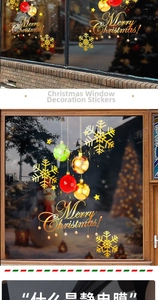 Macro detail of golden snowflake ornaments and Merry Christmas static window decals