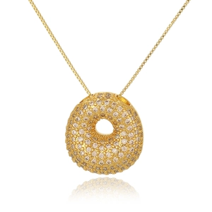 Close-up of golden bubble letter necklace pendant with micro-paved sparkling crystals