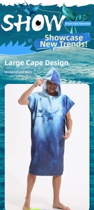 Close-up of microfiber beach poncho with blue manta ray print and let the sea text