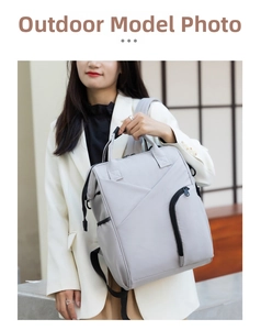Close-up of lightweight grey multi-functional diaper bag with insulated pockets for travel