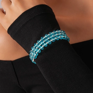 Detail of four-row blue glass bead bracelet with faceted crystals and silver accents