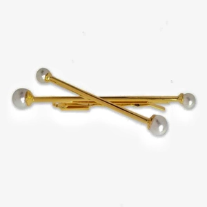 Elegant gold finish hair pins with white faux pearls in a minimalist crisscross layout