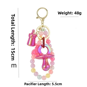 Pink and purple gradient pacifier keychain with beads and measurements displayed