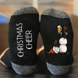 Christmas cotton crew socks featuring snowman prints and Christmas Cheer text on soles
