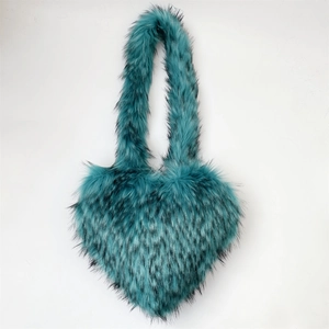 Detail of heart-shaped faux fur bag in cyan and black with long fluffy texture