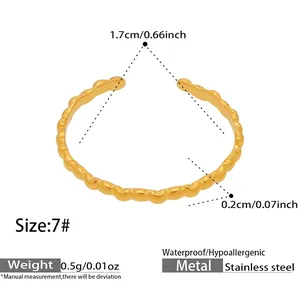 Detail view of wavy gold stainless steel ring with size measurements and dimensions