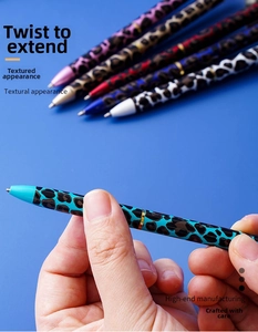 Detail of leopard print metal ballpoint pen with twist mechanism in multiple colors