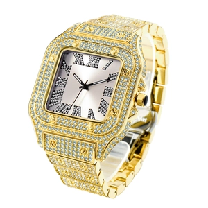 Macro view of gold iced-out square watch with Roman numerals and screw-decorated bezel