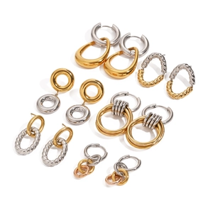 Minimalist stainless steel hoop earrings set in polished gold and silver finishes