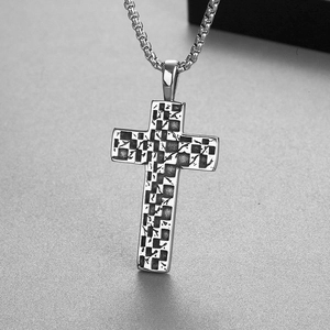 Detailed view of punk style silver stainless steel cross pendant with checkered texture